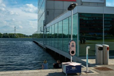 A picture of a building next to a body of water
